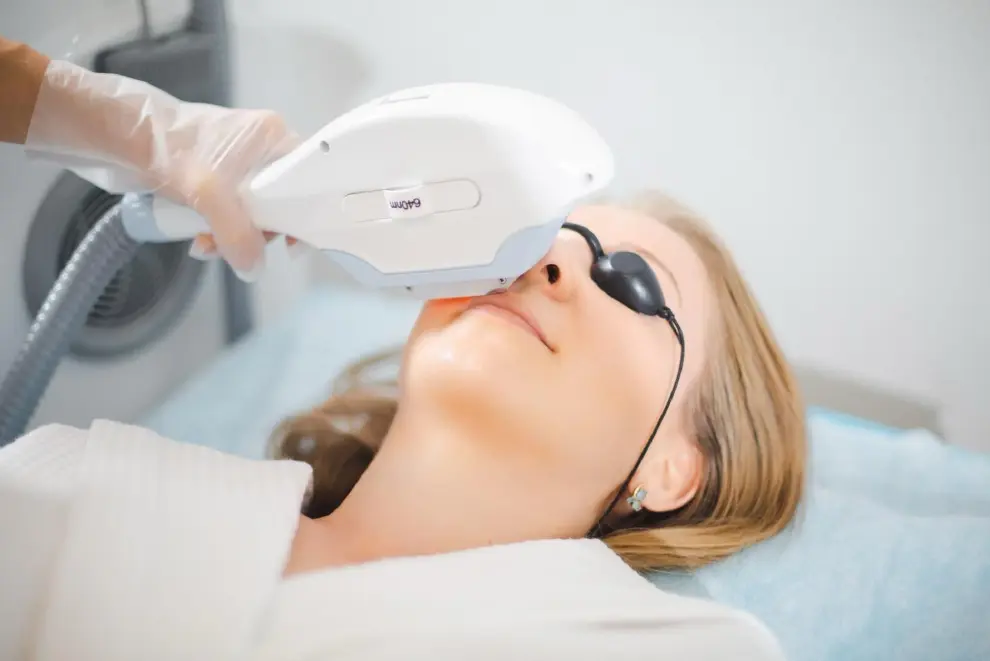 A woman getting her face laser hair removal.